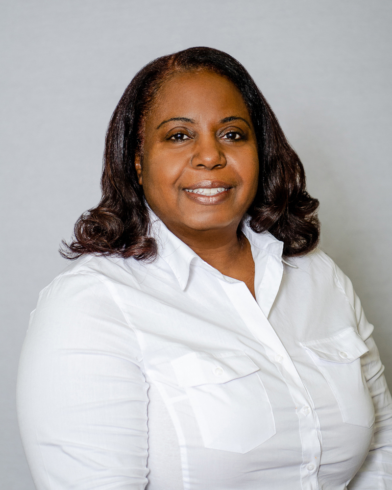 Bessie Chunn smiling for her headshot.